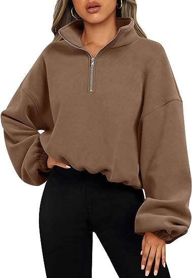 Person wearing a fashionable and simple brown Loose Sport Pullover Hoodie Women Winter Solid Color Zipper Stand Collar Sweatshirt Thick Warm Clothing by Maramalive™, paired with black pants.