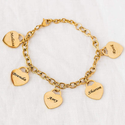 A woman's hand is holding a Love Engraved Bracelet Stainless Steel DIY Personalized from Maramalive™.