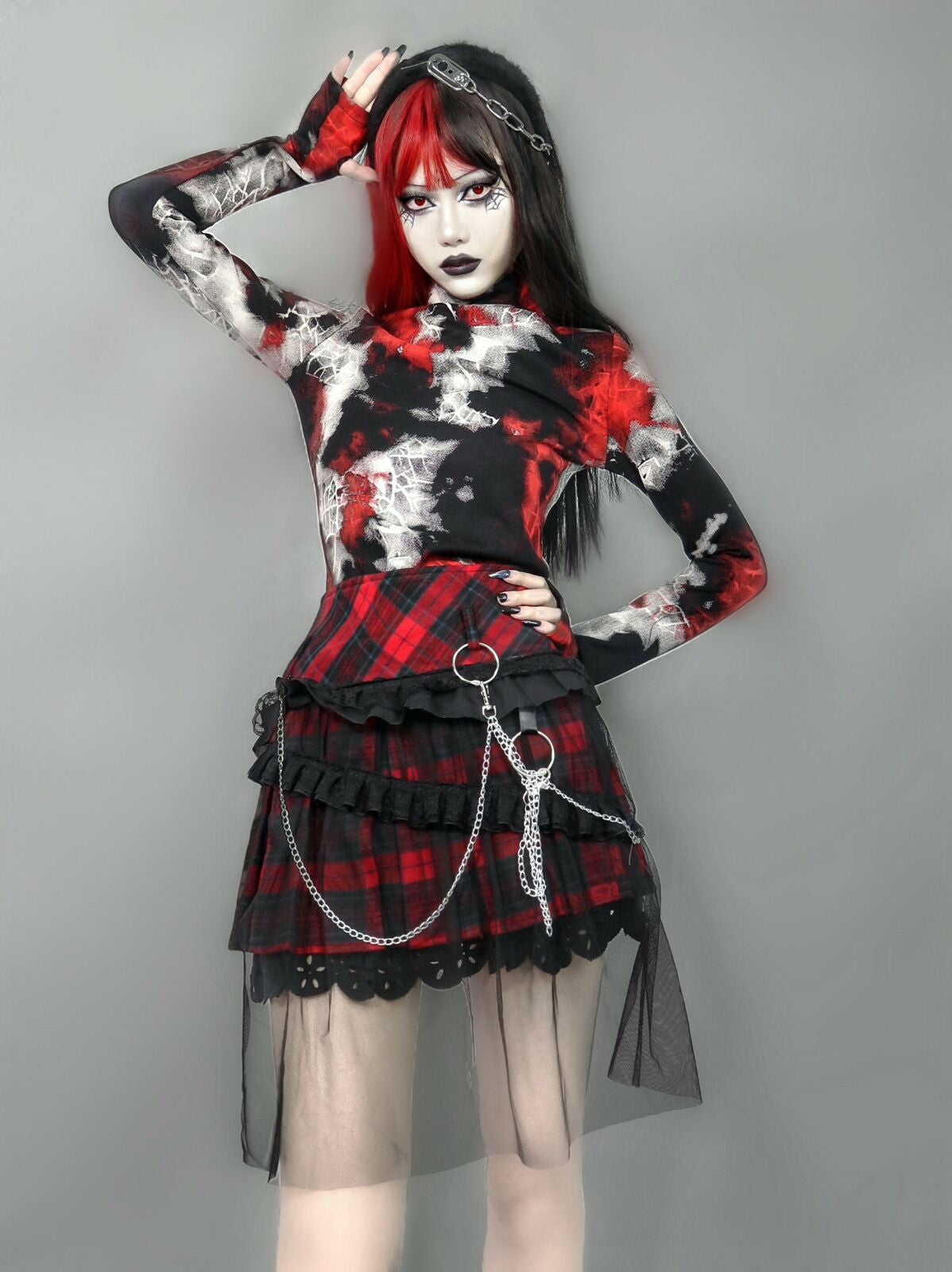 A Maramalive™ woman with black hair and a red and black plaid skirt. She also wore the Gothic Cobweb Long Sleeved Shirt - Punk Spider pattern Top.