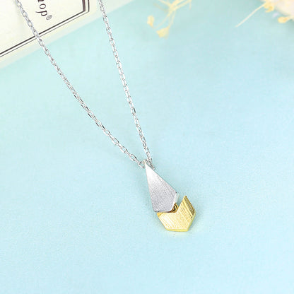A Minimalist Clavicle Chain from Maramalive™ with a yellow and silver triangle pendant.