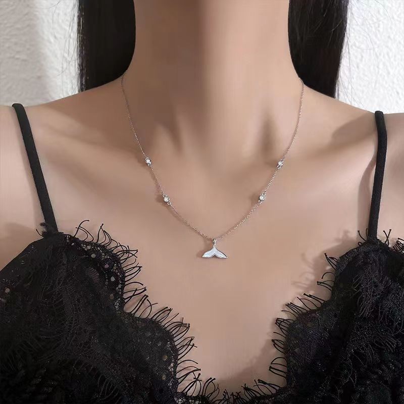 A S925 Sterling Silver Mermaid Necklace from Maramalive™ with a small bird on it.