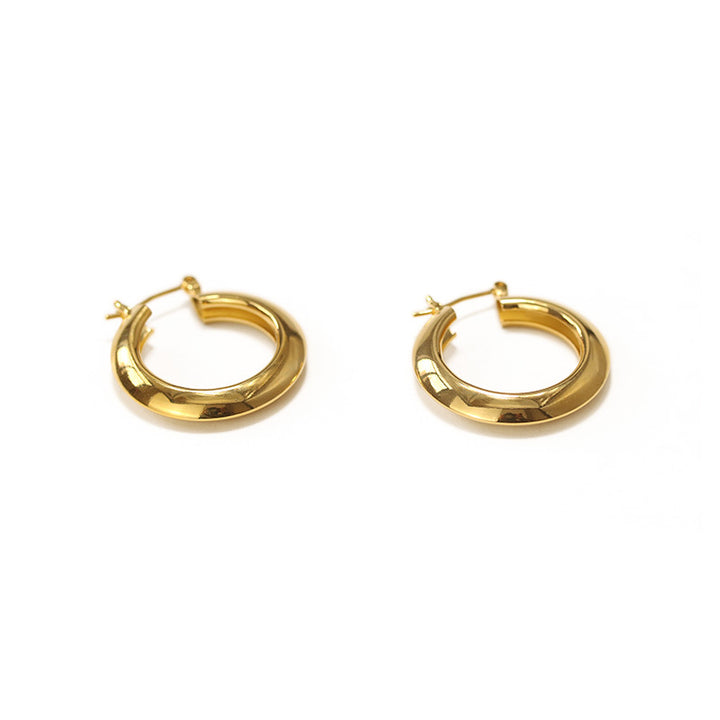 A pair of Circle Earrings by Maramalive™ on a white background.