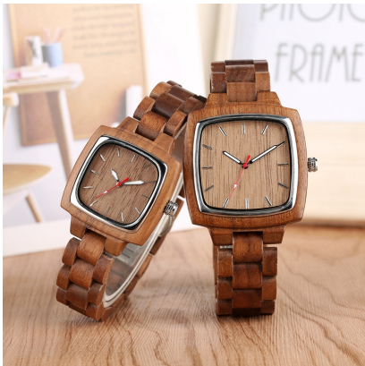Two Bamboo Watches by Maramalive™ on a wooden table.