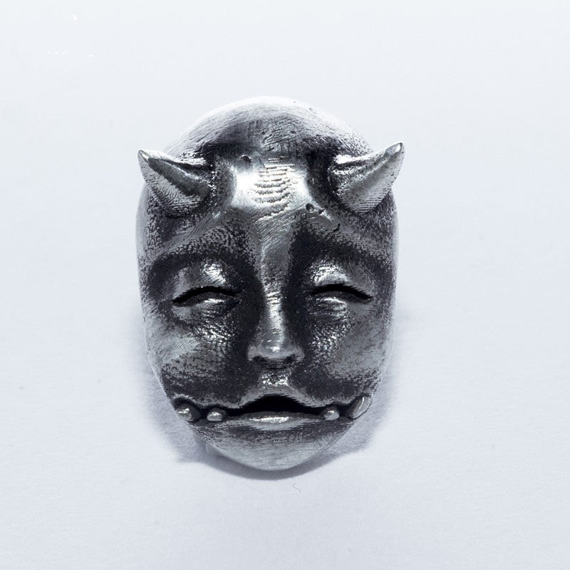 A pair of Gothic Horned Demon Baby Face Stud Earrings Vintage Devil Prajna by Maramalive™ on a white surface.