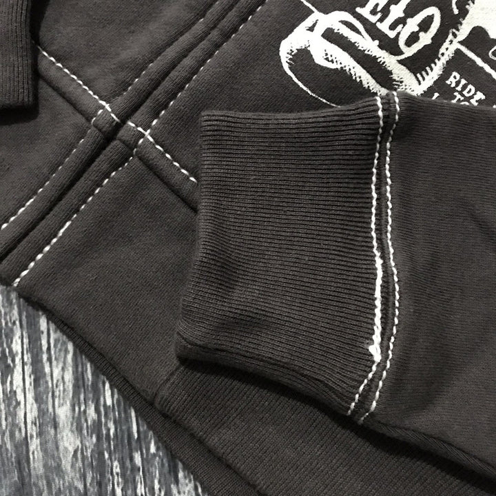 Close-up image of the Maramalive™ Hooded Sweater Motorcycle Heavy Metal Punk Can Take Lovers featuring white stitched seams and a white graphic design. The fabric is ribbed at the wrist hem, ensuring a comfortable, loose fit.