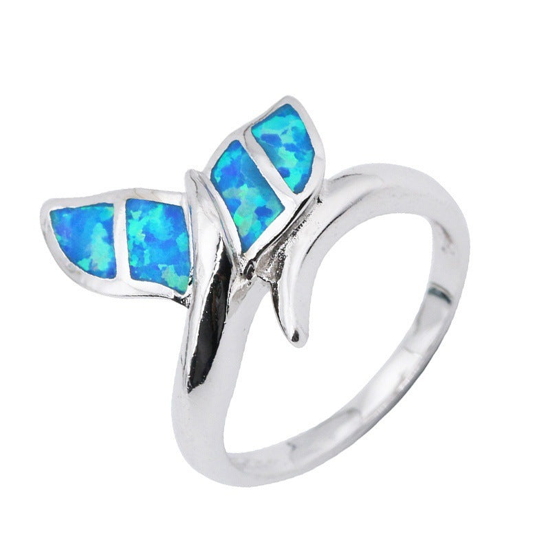 A Maramalive™ Opal Mermaid Tail Ring with a blue opal butterfly.