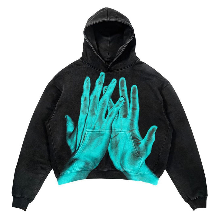 The Maramalive™ Men's Punk Design Printed Hoodie collection presents a black hooded sweatshirt featuring a bright blue graphic of two hands touching on the front. This winter punk hoodie is the perfect blend of unique style and cozy comfort for those chilly days.