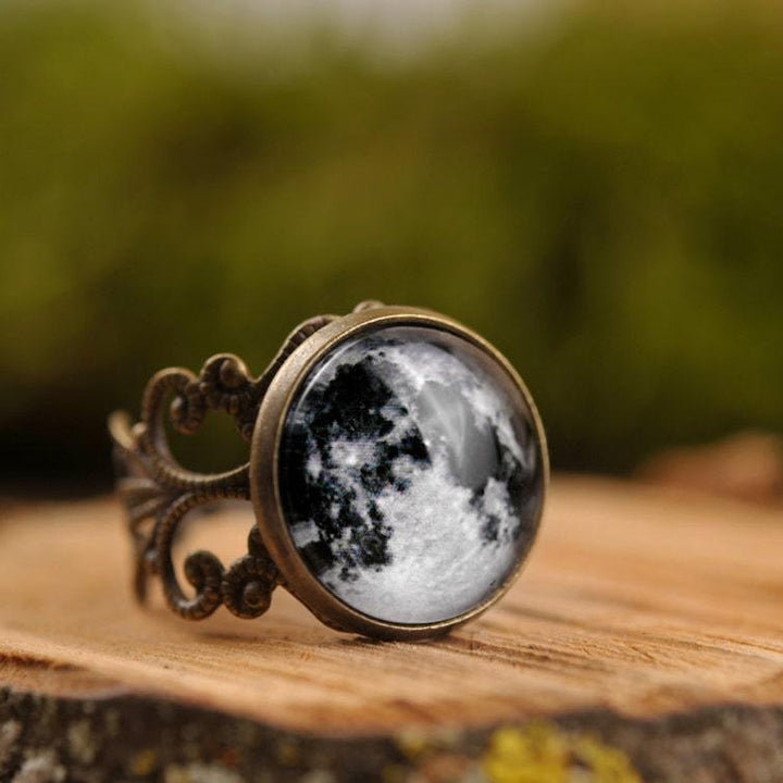 A Vampire Blood Gothic Jewelry Ring with a black and white image of the moon by Maramalive™.