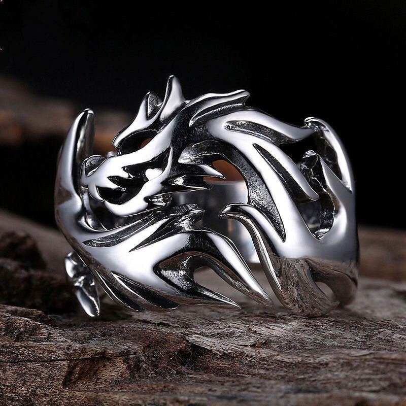 A Dragon Silver Ring by Maramalive™ with a dragon on it.