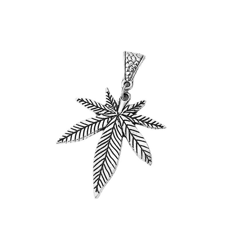 A black choker with a silver Maramalive™ Minimalist Maple Leaf Necklace pendant.