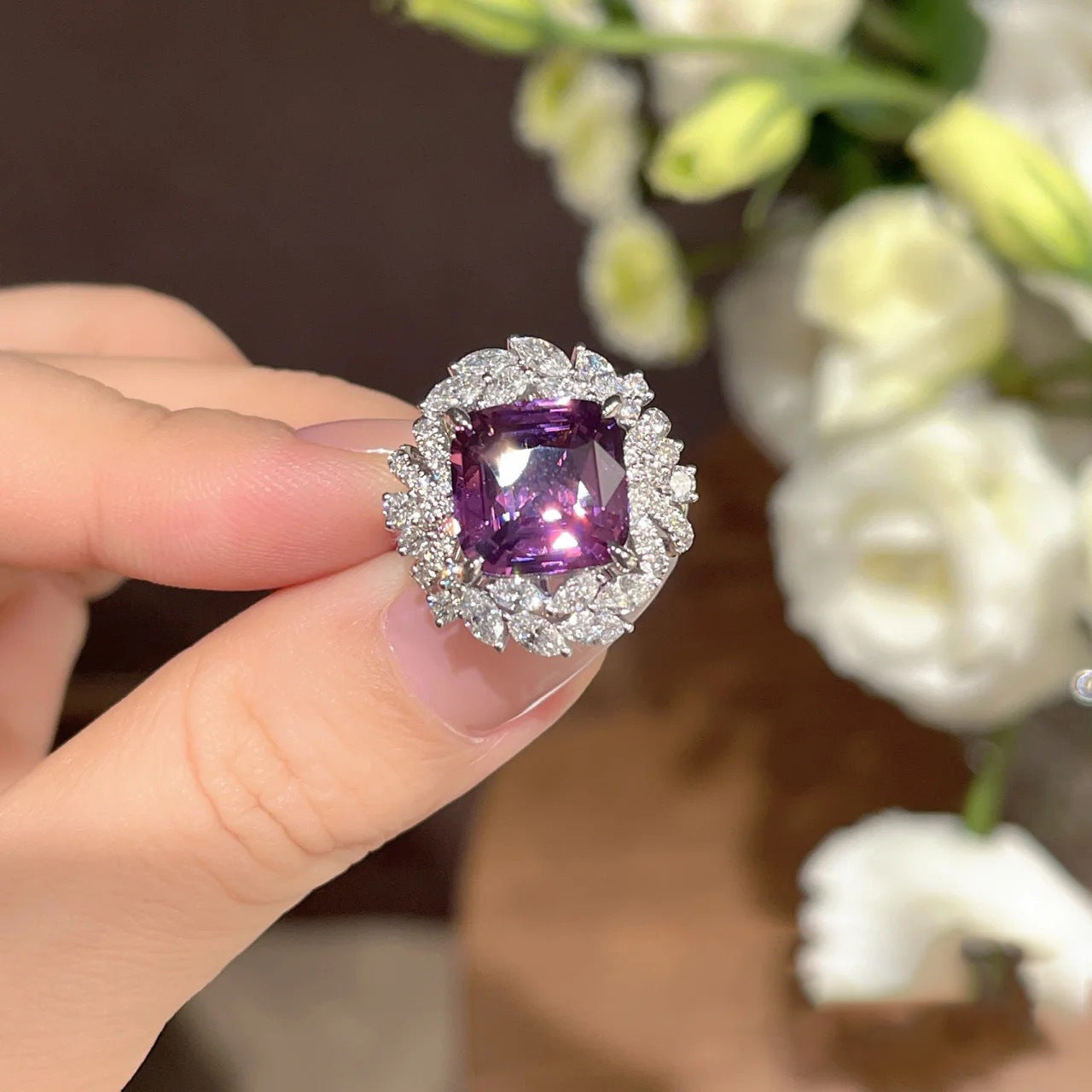 A woman's hand holding a purple Stand out Beautiful Amethyst Gemstone Ring For Women I NEED IT and diamond ring by Maramalive™.