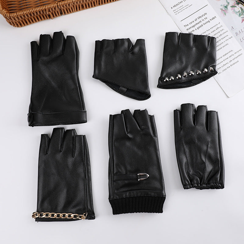 A group of Steampunk Half Finger Gloves - Fashion Statement in PU Leather by Maramalive™ on a table.