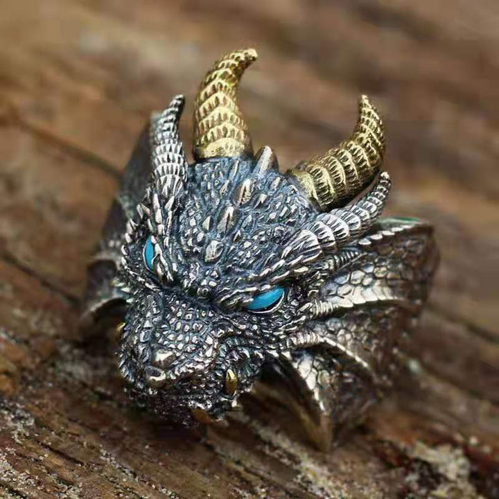 A Maramalive™ dragon ring with red eyes.