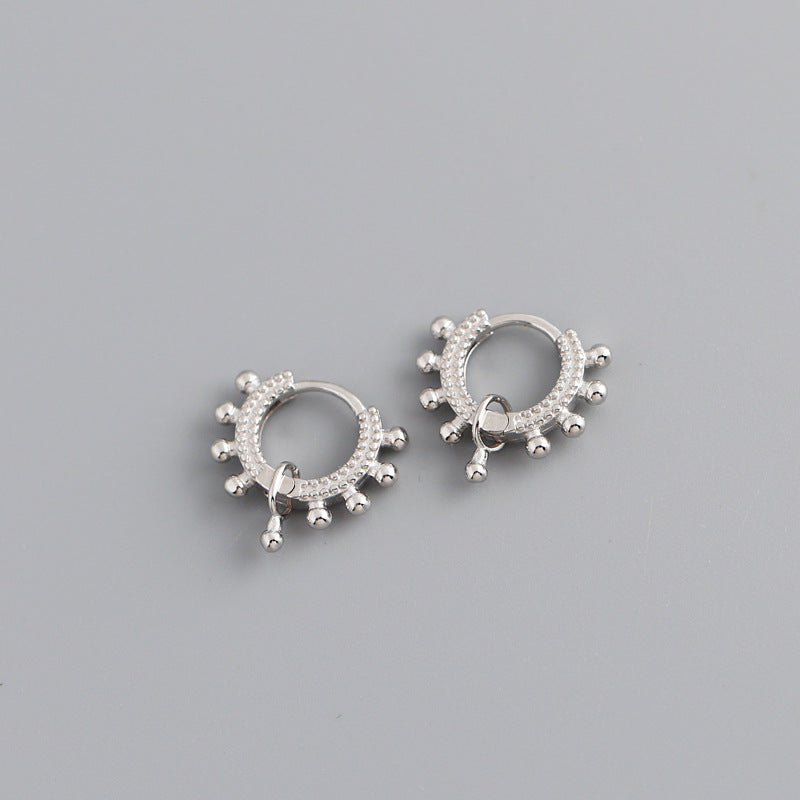 A pair of Minimalist Stainless Steel Bridal Earrings by Maramalive™ on a blue cloth.