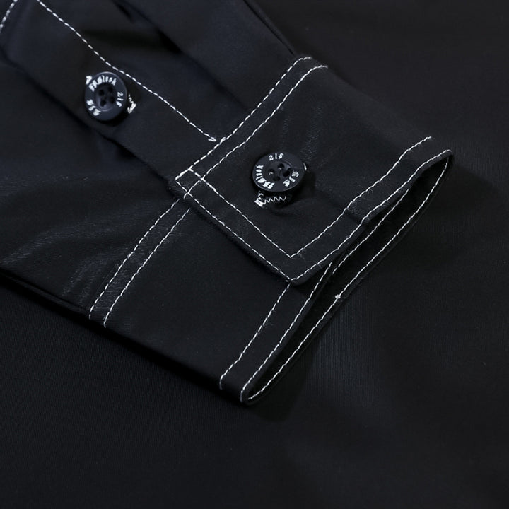 Close-up of a Maramalive™ Men's printed long-sleeve shirts sleeve featuring white stitching and two black buttons on the cuff, with a subtle printed design.