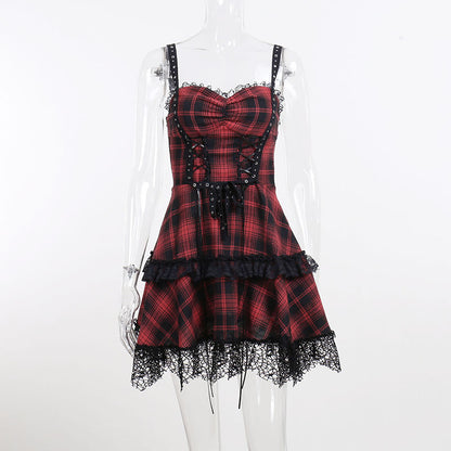 Two women in gothic outfits, one of them wearing the Maramalive™ New Gothic Plaid Suspender Dress - Underworld Tartan Mini-dress, sitting on stairs.
