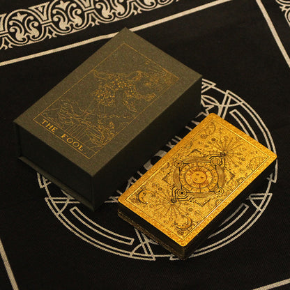 A Waterproof Tarot Instruction Board Game by Maramalive™ sitting on a black cloth.