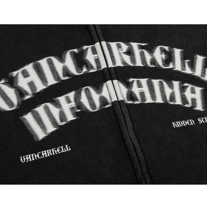 Close-up of a black fabric with white distorted text. The text reads "HAMCARKELL INFONANA" horizontally and "VANCARKELL" along with "HIDDEN SYMBOLS" vertically on the sides. Ideal for street fashion, this Old Dark Shadow Portrait Design Velvet Thickened Hooded Sweatshirt by Maramalive™ boasts a unique design reminiscent of Composite Austrian Fleece.