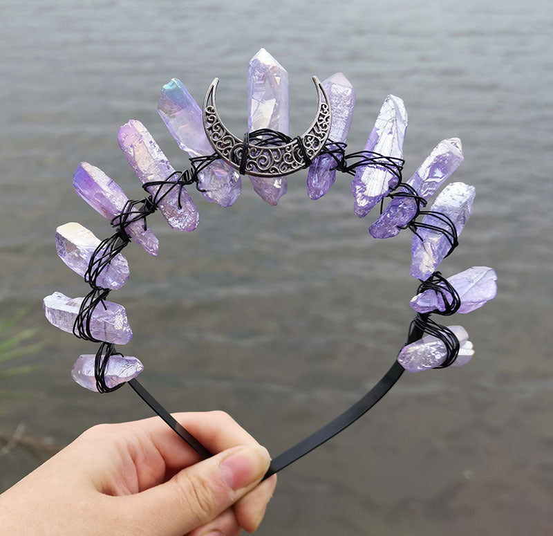 A person holding a Crystal Witch Headband with crystals on it. (Brand Name: Maramalive™)