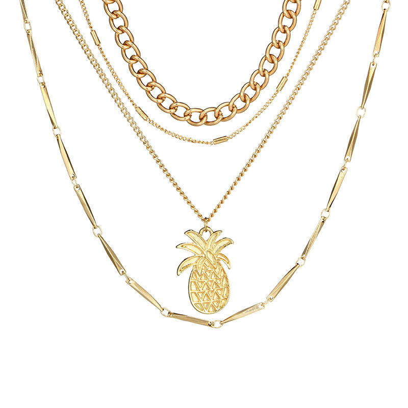 A woman wearing a Maramalive™ gold Pineapple Pendant Necklace choker.