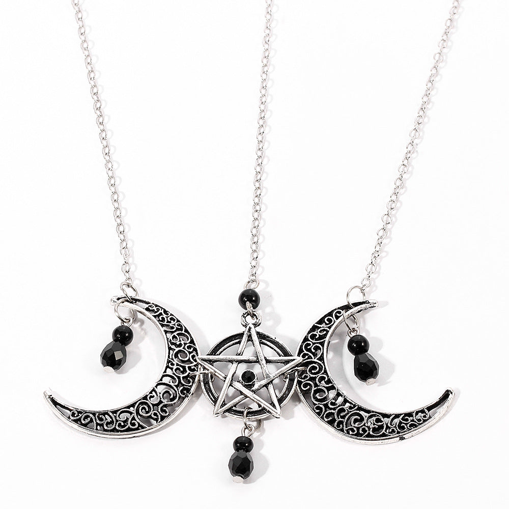 A CJ Gothic Pentagram Necklace Moon Crystal with two crescents on it.