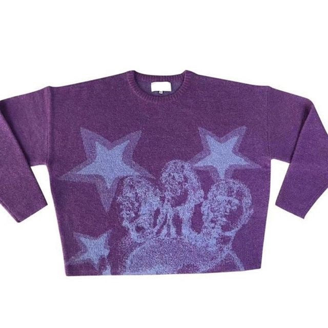 A purple loose fit long-sleeve sweater, reminiscent of an anime sweater, with a graphic design depicting five faces and three stars in a lighter shade, is the Cozy Anime Couples: Loose Sweaters for Relaxed Duos by Maramalive™.