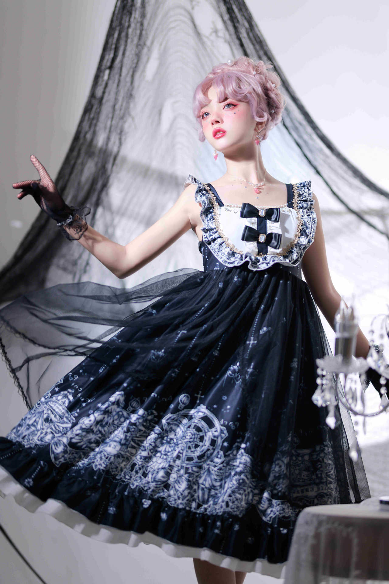 A woman in a Gothic Jsk Lolita Dress Halloween Amusement Park Dark, from the brand Maramalive™, is posing next to a candle.