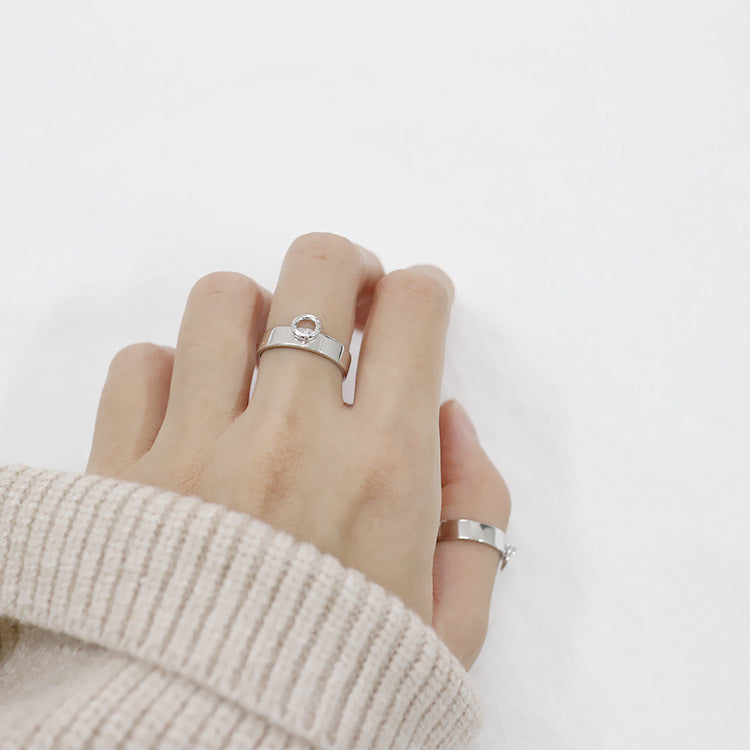 A woman wearing a white sweater and a Maramalive™ Small Hollow Ring.