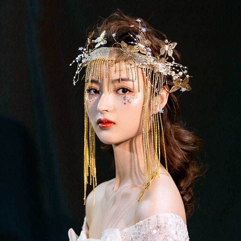 A Korean woman wearing a Maramalive™ bridal vintage headdress with butterflies on it.