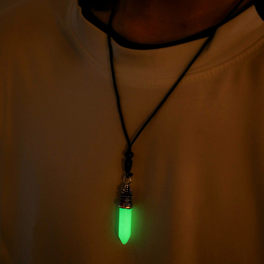 A person wearing a Dragon Claw Pearl Pendant Necklace which glows in the dark from Maramalive™.