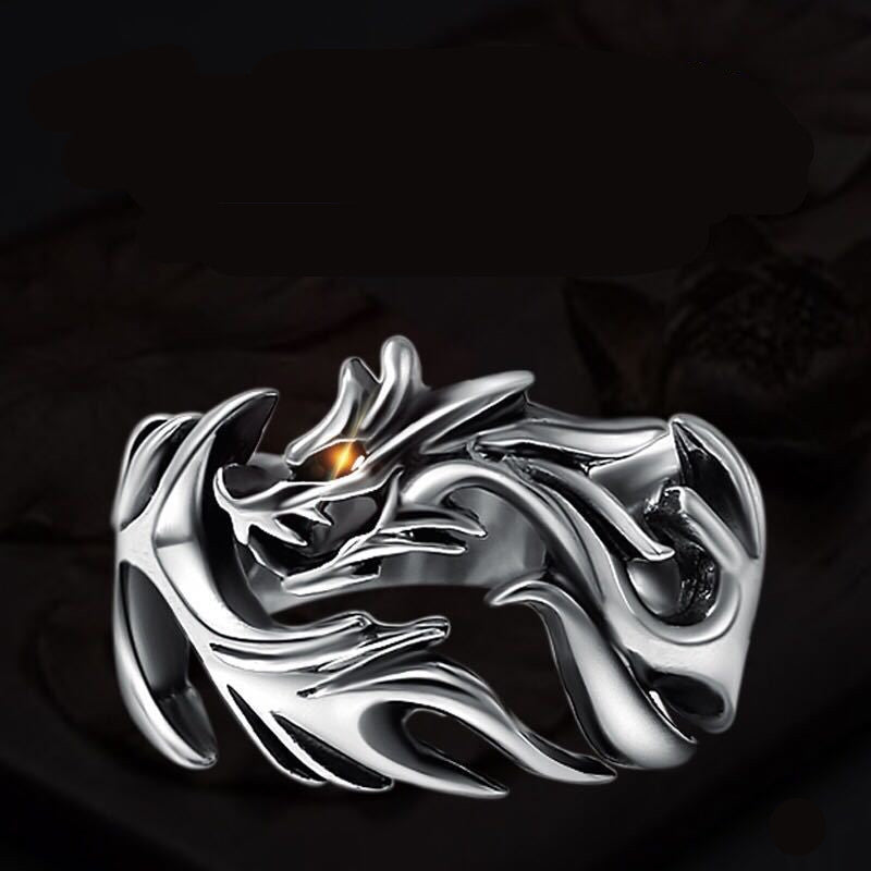 A Dragon Silver Ring by Maramalive™ with a dragon on it.