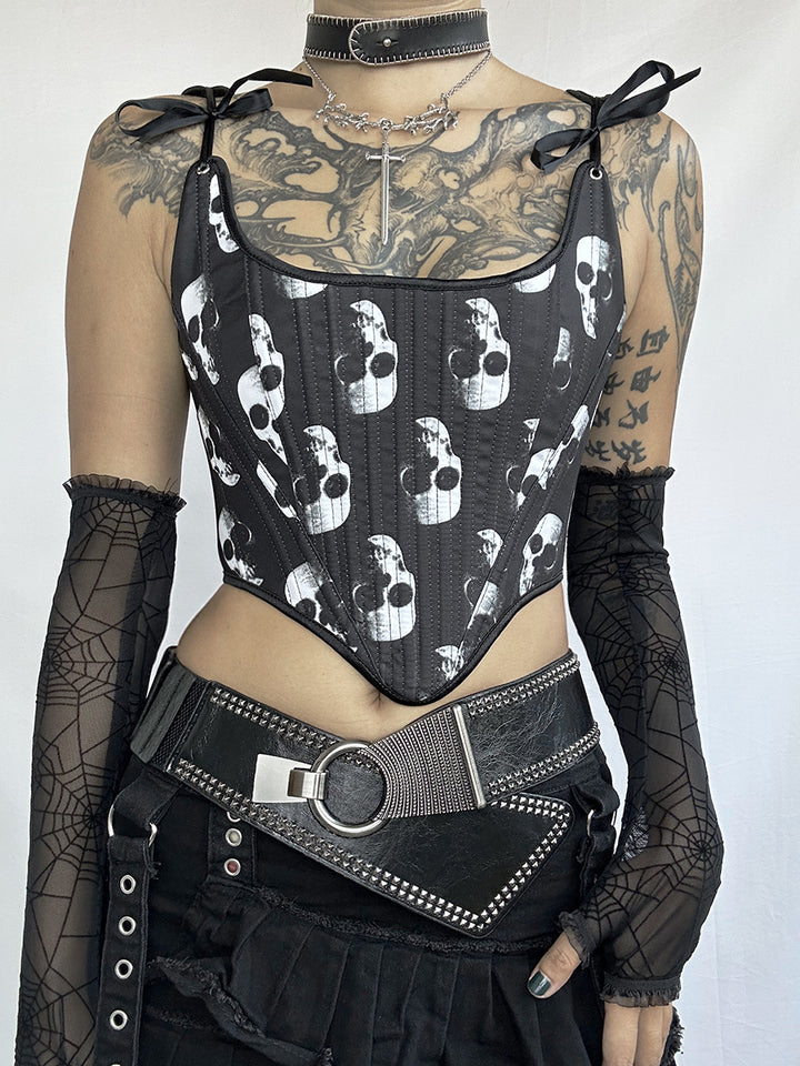 A person wearing the Maramalive™ Exclusive Dark Gothic Punk Corset tie Designs Unveiled with a white skull print, black mesh gloves, a wide belt with metal accents, and a black choker with a cross pendant. Their upper chest and arms have numerous tattoos, exuding an edgy gothic punk vibe.