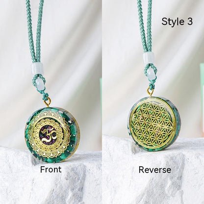A hand holding two European And American Fashion Men's And Women's Necklace Pendants with a mandala design on them from Maramalive™.