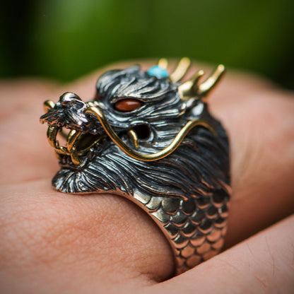 A person wearing a Maramalive™ handmade dragon ring.