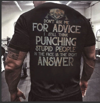 A man wearing a Maramalive™ Men's Skull Slogan Print Tee that says don't ask for advice for punching stupid people.