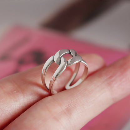A Minimalist Sterling Silver Geometric Ring with a chain on it, by Maramalive™.