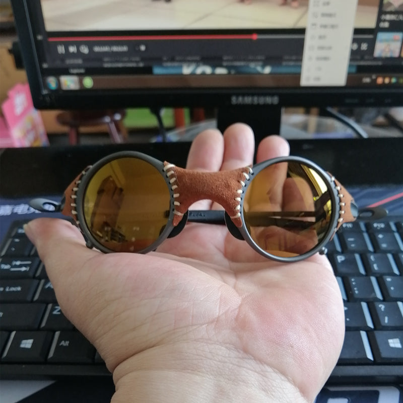 A person holding a pair of Maramalive™ Steampunk Retro Polarized Color Film Sports Sunglasses in front of a computer.