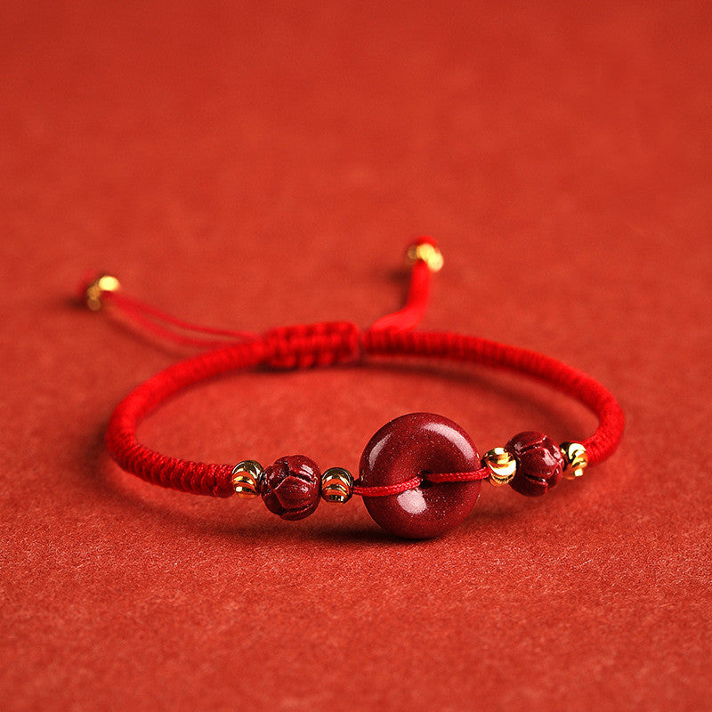 A woman's hand with a Maramalive™ Men's And Women's Fashion Cinnabar Peace Buckle Woven Bracelet on it.