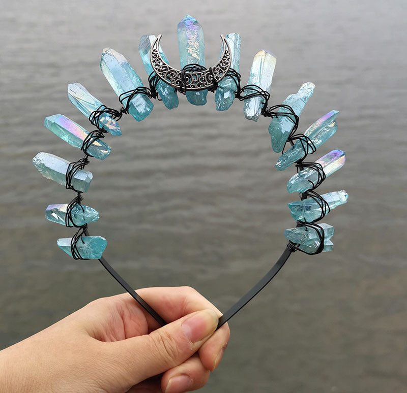 A person holding a Crystal Witch Headband with crystals on it. (Brand Name: Maramalive™)