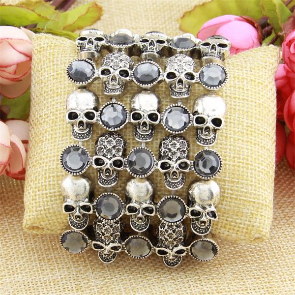 A Maramalive™ Unusual Skull skeleton stretch bracelet for women biker bling jewelry antique gold silver plated with crystals and flowers.