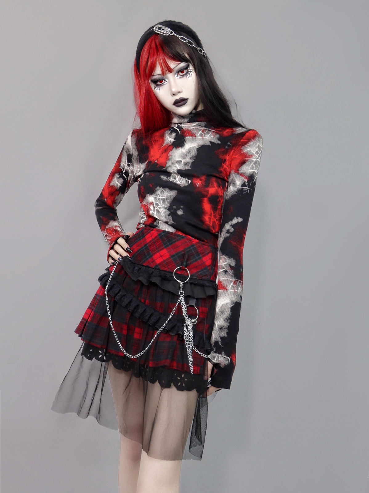 A Maramalive™ woman with black hair and a red and black plaid skirt. She also wore the Gothic Cobweb Long Sleeved Shirt - Punk Spider pattern Top.