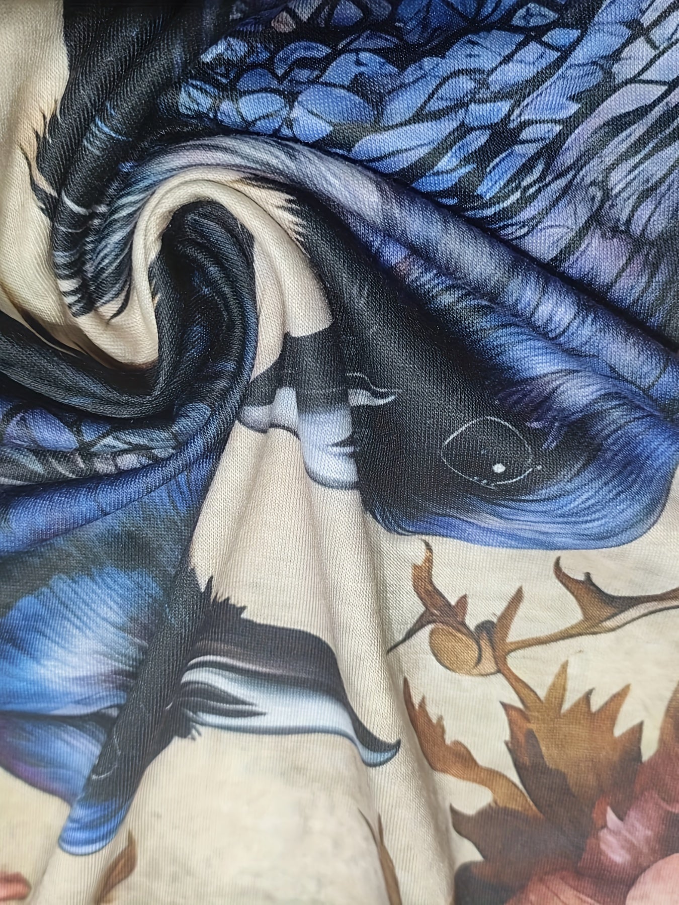 Close-up of a fabric with detailed, colorful print featuring parts of birds and flowers, swirled into a central spiral pattern, showcasing micro elasticity for added comfort. Product shown is the Birds & Floral Print T-shirt, Vintage Crew Neck Long Sleeve T-shirt from Maramalive™, Women's Clothing.