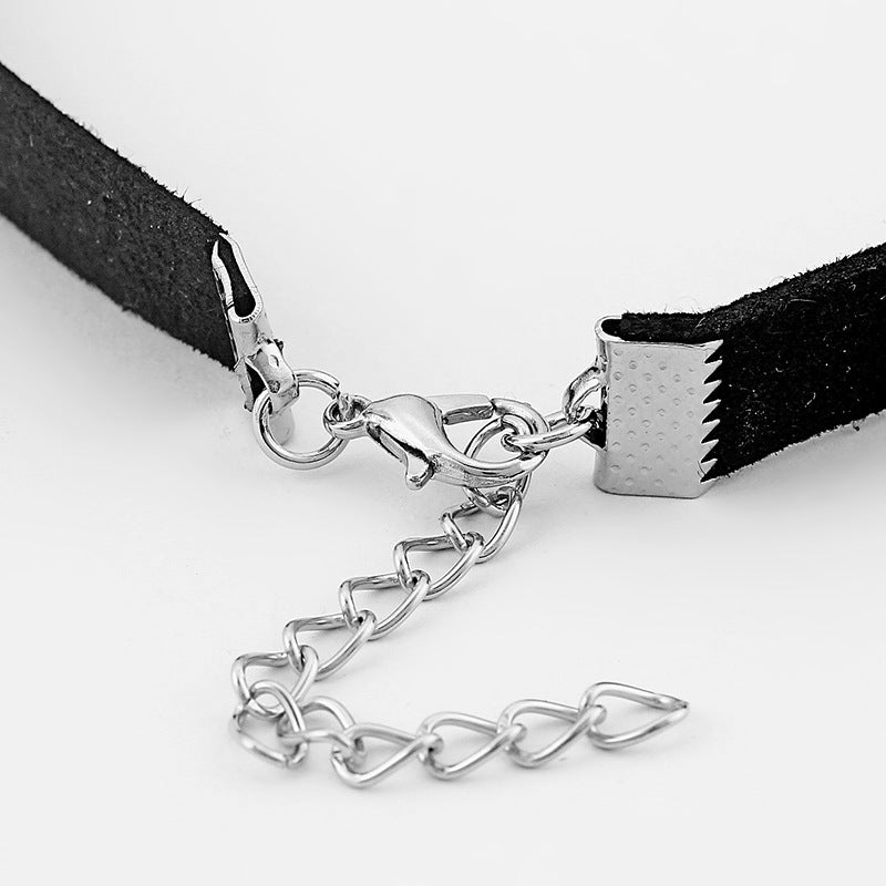 A black choker with a silver Maramalive™ Minimalist Maple Leaf Necklace pendant.
