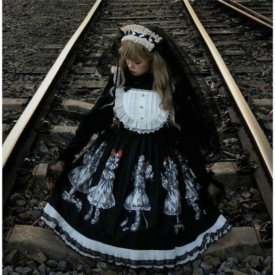 A Gothic girl in a Dark Retro Gorgeous Gothic Simple - Lolita Dress Suspender Skirt by Maramalive™ sits on a train track.