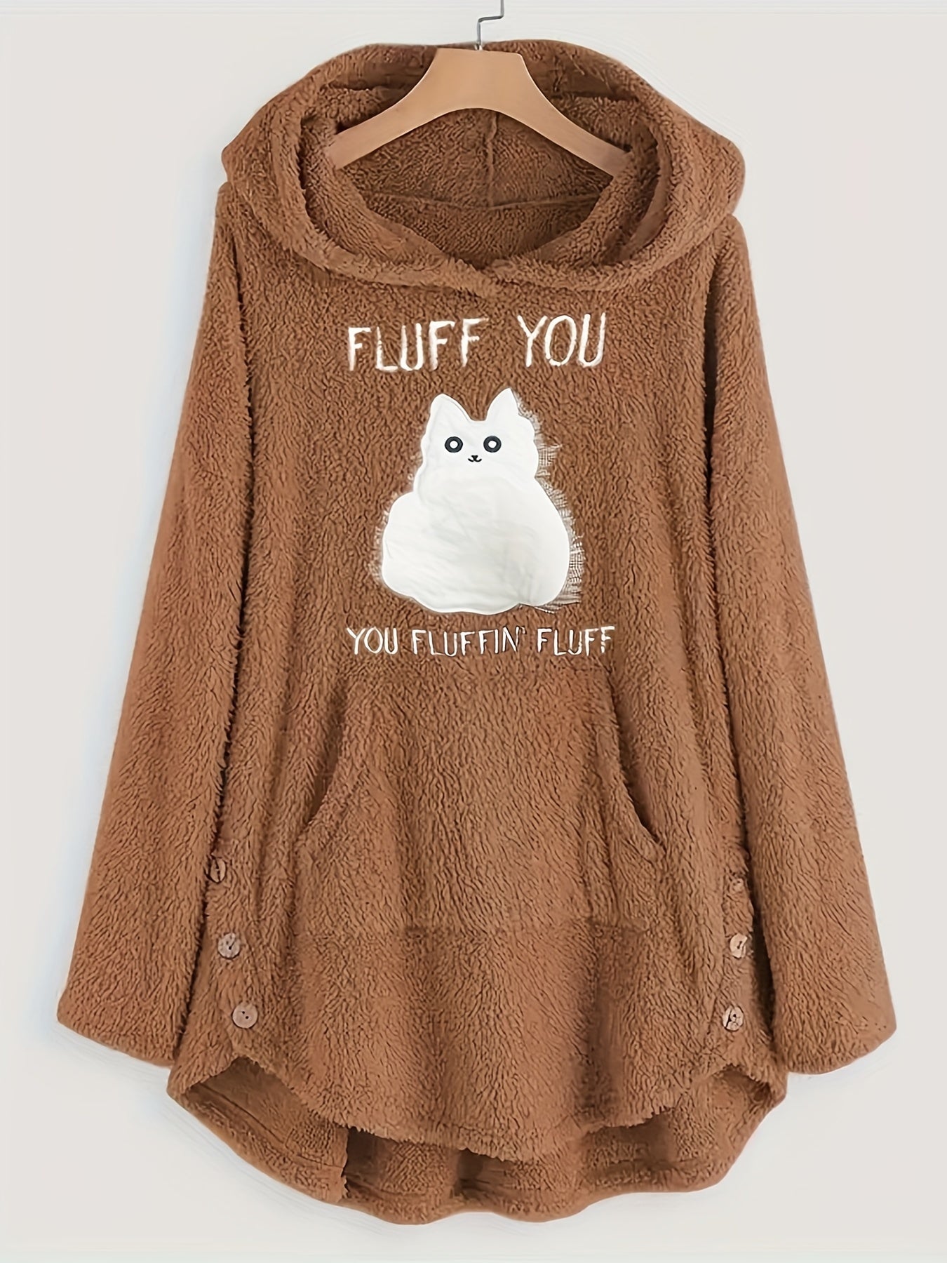 A brown, long-sleeve, fleece hoodie with a hood and front pockets. This Maramalive™ Plus Size Casual Sweatshirt, Women's Plus Slogan & Cat Print Fleece Button Decor Long Sleeve Cat Ear Button Decor Sweatshirt With Pockets features an illustration of a fluffy white cat with the text "Fluff You, You Fluffin' Fluff" on the front, designed in a charming cartoon pattern.