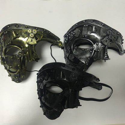 A couple of Maramalive™ Halloween Steampunk Masquerade Party Half Face Masks sitting on top of a table.