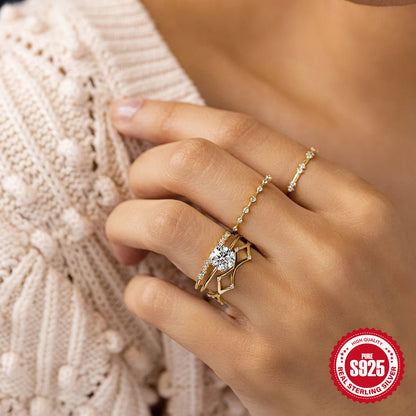 A woman's hand holding a Maramalive™ S925 Sterling Silver Six Claw Diamond Ring.