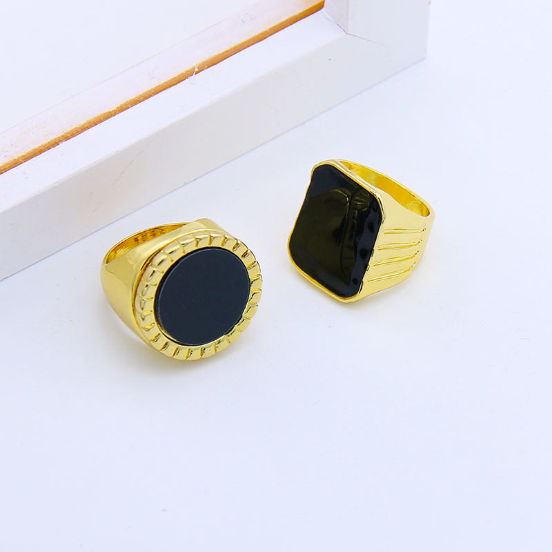 A woman wearing a Maramalive™ Fashion Creative Geometric Glossy Black Onyx Ring.