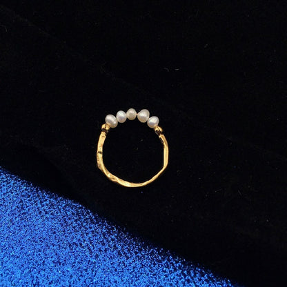 A Maramalive™ freshwater pearl ring on a blue background.
