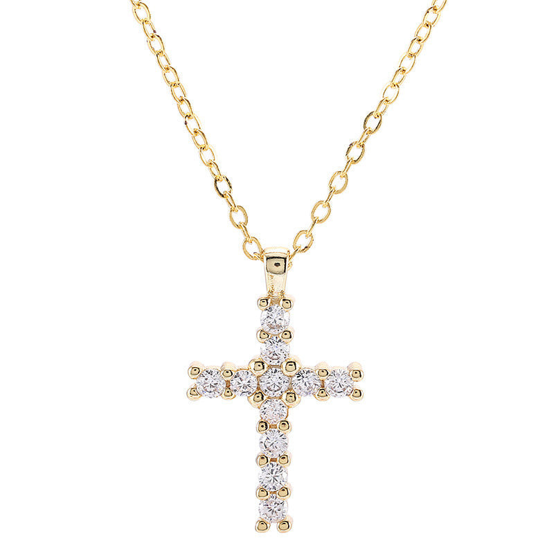 A woman with long blonde hair wearing sunglasses in a car is wearing the Gothic Zircon Cross Necklace from Maramalive™.